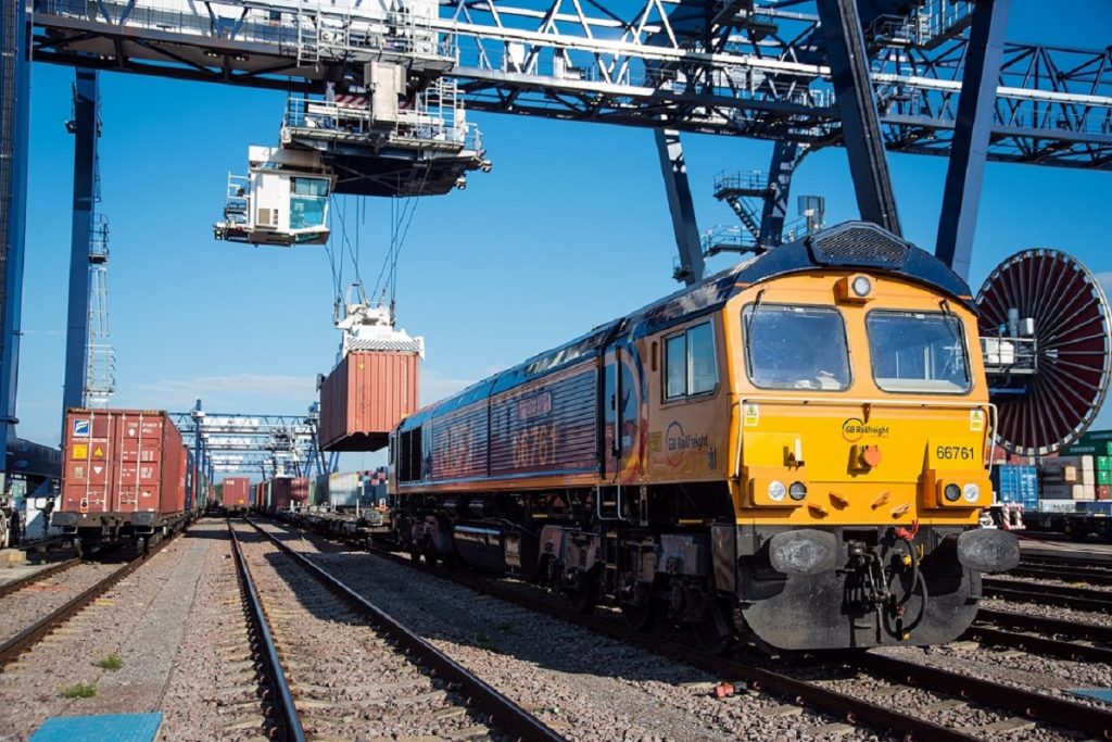 A freight train having shipping containers removed from it